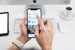 Woman goes through the verification process to verify her business Instagram account on a smartphone.