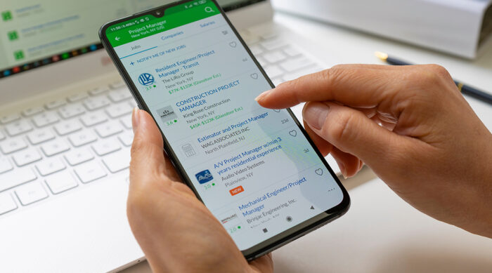 User reads through employee reviews of a company on Glassdoor.