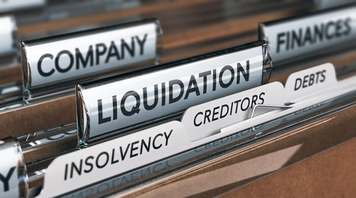 Close up view of brown file folders with various labeling for bankruptcy.