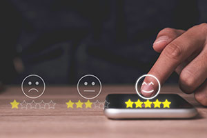 Person leaving a 5 star review on mobile device