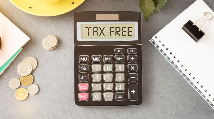 A black calculator with tax free displayed on the screen.